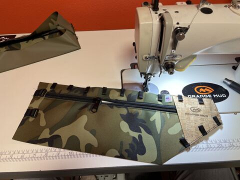 Custom camo pouch being sewn in-house at Seven Clay