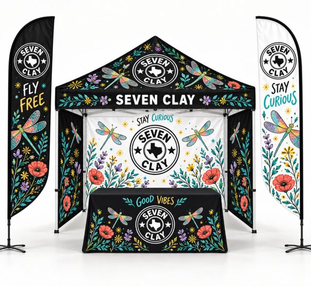 Custom trade show booth: canopy tent, stretch table cover and feather flags with Seven Clay logo